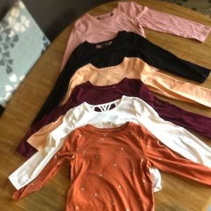 Girls size 6-7 long-sleeve shirts.